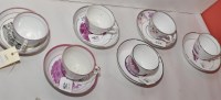 Lot 256 - A set of six specimen tea cups and saucers,...