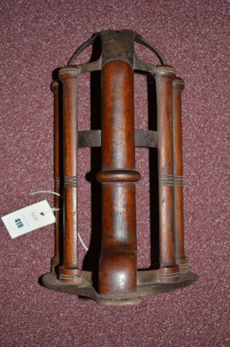 Lot 419 - A cast iron and mahogany wall bracket for...