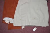 Lot 444 - A pair of terracotta trousers, by Barbour 42...