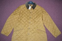 Lot 452 - A Barbour mustard coloured quilted nylon...