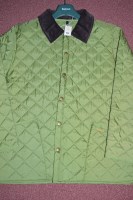 Lot 453 - A Barbour pale-green quilted nylon jacket with...