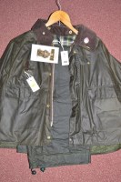 Lot 458 - A Barbour waxed green cotton Spey jacket, size...
