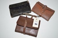 Lot 483 - Three fisherman's leather fly and cast wallets,...
