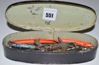 Lot 551 - An oval japanned tin box containing fishing...