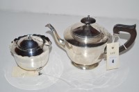 Lot 4 - A silver teapot by Adie Bros., with wooden...