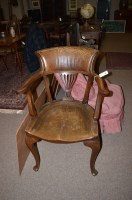 Lot 672 - An early 20th Century elbow chair with shaped...