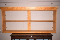 Lot 748 - A modern sycamore and walnut open hanging...