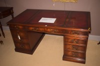 Lot 785 - A reproduction mahogany pedestal desk, inset...