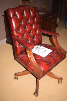 Lot 786 - A reproduction red leather office open arm...
