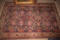 Lot 393 - An antique Malaya rug decorated with foliate...
