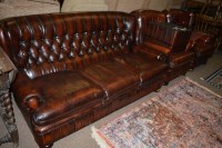 Lot 633 - A red stained leather drawing room suite, to...