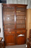 Lot 645 - An early 20th Century bookcase cabinet, the...