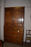 Lot 663 - A 19th Century oak cabinet, the panel doors...