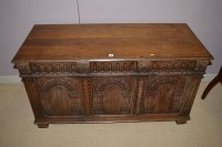 Lot 689 - An 18th Century style carved oak blanket box,...