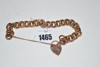 Lot 1465 - A 9ct. gold curb link pattern bracelet with...