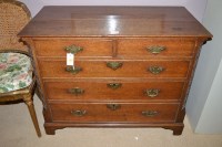 Lot 1864 - A George III oak chest of two short and three...