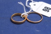 Lot 98 - Two 22ct yellow gold wedding bands, ring sizes...