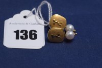 Lot 136 - A pair of cultured pearl earrings on yellow...