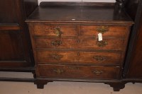 Lot 710 - A Georgian mahogany chest of two short and...
