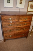 Lot 873 - A late Georgian mahogany bowfront chest of two...