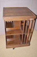 Lot 893 - An early 20th Century oak revolving bookcase...
