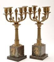 Lot 230 - A pair of ormolu four-branch candlesticks,...