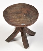 Lot 250 - A Polynesian carved hardwood stool, possibly...