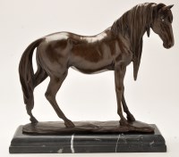 Lot 319 - A modern patinated bronze model of a horse,...