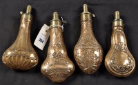 Lot 364 - Four 19th Century copper powder flasks: one...