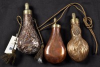 Lot 366 - Three 19th Century copper powder flasks, one...
