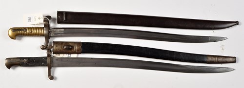 Lot 392 - Two 19th Century sword bayonets, one French,...