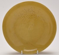 Lot 554 - Chinese yellow monochrome saucer dish, of...