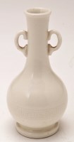 Lot 555 - Chinese white ware bottle vase, bulbous body...