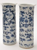 Lot 557 - Pair of Chinese blue and white cylinder vases,...
