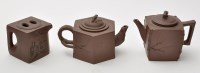 Lot 569 - Three Chinese geometric section Yixing teapots...