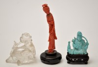 Lot 595 - Three carved figures, comprising: coral figure...