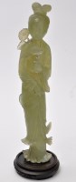 Lot 603 - Green hardstone figures of Guanyin standing...