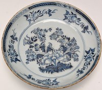 Lot 649 - Blue and white delftware shallow bowl, the...