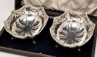 Lot 699 - A pair of George V pierced silver baskets, by...