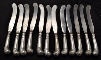 Lot 735 - Twelve Georgian silver handled table knives,...