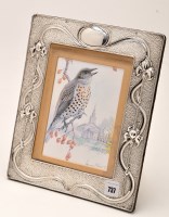 Lot 737 - An Edwardian silver easel backed photograph...