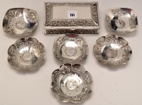 Lot 791 - Six Indian embossed white metal dishes,...