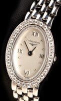 Lot 848 - Longines: a lady's 18ct. white gold and...