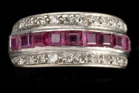 Lot 861 - A ruby and diamond ring, set with a row of ten...