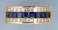 Lot 868 - A sapphire and diamond dress ring, set with a...