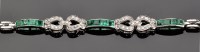 Lot 869 - An Art Deco diamond, emerald and white metal...