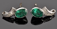 Lot 871 - A pair of emerald and diamond earrings, each...