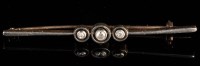 Lot 875 - An early 20th Century diamond bar brooch, set...