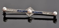 Lot 880 - A cultured pearl, diamond and sapphire Art...