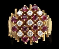 Lot 884 - A modern designed diamond and ruby ring, the...